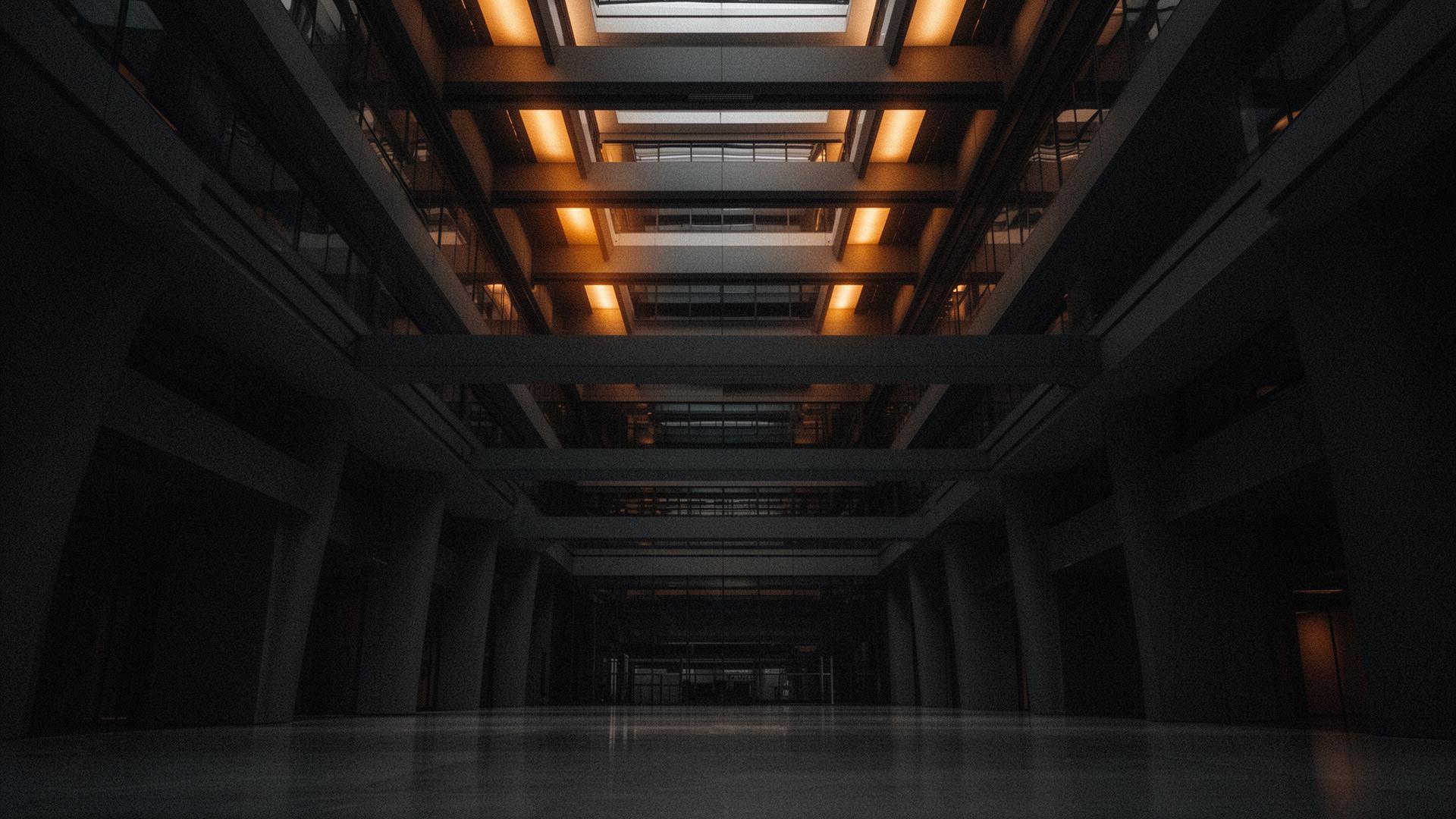Architectural atrium in amber light, sense of scale.